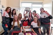 28 September 2015; Aidan O'Brien, age 7, from Mallow, Co. Cork, with Cork ladies footballers, from left, Sinead Cotter, Aisling Barrett, Roisin Phelan, Ciara O'Sullivan, Laura Crowley, Aine Terry, Kate Leneghan and Aisling Hutchings during a visit by the TG4 Ladies Football All-Ireland Senior Champions to  Crumlin Children's Hospital, Crumlin, Dublin. Picture credit: Matt Browne / SPORTSFILE