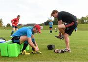 28 September 2015; Munster's Tyler Bleyendaal and scrum coach Jerry Flannery put on their boots before squad training. Munster Rugby Squad Training, University of Limerick, Limerick. Picture credit: Diarmuid Greene / SPORTSFILE
