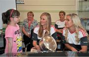 28 September 2015; Aimee-Lousie Fenton, from Midleton, Co. Cor , with Cork Ladies footballers Roisin Phelan and Brid Stack during a visit by the TG4 Ladies Football All-Ireland Senior Champions to Temple Street Hospital, Temple Street, Dublin. Picture credit: Sam Barnes / SPORTSFILE