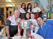 28 September 2015; Shayne Moran, age 5, from Leitrim Village, Co. Leitrim, with his parents and Cork ladies football manager Eamonn Ryan and players, from left,  Sinead Cotter, Aisling Barrett and Aisling Hutchings  during a visit by the TG4 Ladies Football All-Ireland Senior Champions to Temple Street Hospital, Temple Street, Dublin. Picture credit: Sam Barnes / SPORTSFILE