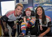 28 September 2015; Oran Neacy, age 4, from Ardee, Co. Louth, with Cork ladies footballers Valerie Mulcahy, left, and Ciara O'Sullivan during a visit by the TG4 Ladies Football All-Ireland Senior Champions to Temple Street Hospital, Temple Street, Dublin. Picture credit: Sam Barnes / SPORTSFILE