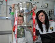 28 September 2015; Leon Daly, age 6, from Dublin City, with Cork ladies footballer Aisling Barrett during a visit by the TG4 Ladies Football All-Ireland Senior Champions to Temple Street Hospital, Temple Street, Dublin. Picture credit: Sam Barnes / SPORTSFILE