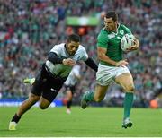 27 September 2015; Rob Kearney, Ireland, on his way to scoring his side's fifth try despite the tackle of Paula Kinikinilau, Romania. 2015 Rugby World Cup, Pool D, Ireland v Romania, Wembley Stadium, Wembley, London, England. Picture credit: Stephen McCarthy / SPORTSFILE