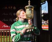 30 April 2009; Nina Carberry with the La Touche Cup after winning the the Avon Ri Corporate & Leisure Resort Steeplechase For The La Touche Cup onboard Garde Champetre. 2009 Punchestown Irish National Hunt Festival, Punchestown Racecourse, Co. Kildare. Picture credit: Matt Browne / SPORTSFILE