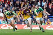 3 May 2009; Michael Jacob, Wexford, in action against Daniel Currams, left, and Derek Molloy, Offaly. Allianz GAA NHL Division 2 Final, Wexford v Offaly, Semple Stadium, Thurles, Co. Tipperary. Picture credit: Diarmuid Greene / SPORTSFILE
