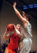 17 December 2000; Jonathan Grennell of Thorn Killester in action against Gareth Maguire of Star of the Sea during the ESB Men's Superleague match between Thorn Killester and Star of the Sea at Clontarf in Dublin. Photo by Brendan Moran/Sportsfile