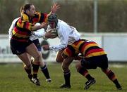 30 December 2000; Ronan O'Donovan of Cork Constitution RFC is tackled by Rory Kearns and David Quigley of Lansdowne RFC during the AIB All-Ireland League Division 1 match between Cork Constitution RFC and Lansdowne RFC at Temple Hill in Cork. Photo by Brendan Moran/Sportsfile