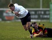 30 December 2000; Ronan O'Gara of Cork Constitution RFC is tackled by David Quigley of Lansdowne RFC during the AIB All-Ireland League Division 1 match between Cork Constitution RFC and Lansdowne RFC at Temple Hill in Cork. Photo by Brendan Moran/Sportsfile