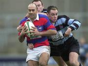 31 December 2000; Kevin Nowlan of Clontarf is tackled by Niall McNamara and John O'Neill of Shannon during the AIB All-Ireland League Division 1 match between Shannon and Clontarf at Thonond Park in Limerick. Photo by Brendan Moran/Sportsfile