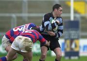31 December 2000; Niall McNamara of Shannon is tackled by David O'Brien, 12, and Alan Reddan, 13, of Clontarf during the AIB All-Ireland League Division 1 match between Shannon and Clontarf at Thonond Park in Limerick. Photo by Brendan Moran/Sportsfile