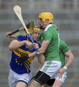 9 June 2013; Padriac Mhaer of Tipperary in action against David Breen of Limerick during the Munster GAA Hurling Senior Championship Semi-Final match between Limerick and Tipperary at Gaelic Grounds in Limerick. Photo by Ray McManus/Sportsfile