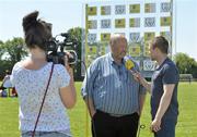 9 June 2013; Aiden Power, from Aviva, interviews Larry Earls, Chairman of Parkville United, during the presentation of the Aviva Club of the Month Award to Parkville United FC at Parkville United A.F.C, Hawkins Lane in Tullow, Carlow. The prestigious award, which is the benchmark for how well Irish football clubs are performing on and off the pitch, is run from October through to May with a different club selected every month as the Aviva Club of the Month, receiving €1,500 to assist in their overall development. Each of the monthly winners then go forward as finalists to the Club of the Year which is chosen at the FAI Festival of Football and AGM. Photo by Matt Browne/Sportsfile