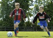 9 June 2013; Cian Gorman-Comerford, left, in action against Kian Byrne during the presentation of the Aviva Club of the Month Award to Parkville United FC at Parkville United A.F.C, Hawkins Lane in Tullow, Carlow. The prestigious award, which is the benchmark for how well Irish football clubs are performing on and off the pitch, is run from October through to May with a different club selected every month as the Aviva Club of the Month, receiving €1,500 to assist in their overall development. Each of the monthly winners then go forward as finalists to the Club of the Year which is chosen at the FAI Festival of Football and AGM. Photo by Matt Browne/Sportsfile