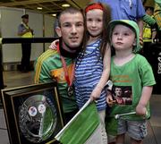 9 June 2013; Ireland's John Joe Nevin, who won gold in the 56kg Bantamweight division, with his five-year-old sister Alice and 3-year-old son Martin on his arrival home from the EUBC European Men's Boxing Championships 2013 in Belarus, at Dublin Airport. Photo by Matt Browne/Sportsfile