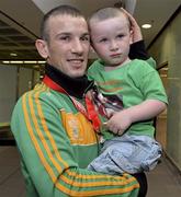 9 June 2013; Ireland's John Joe Nevin, who won gold in the 56kg Bantamweight division, with his 3-year-old son Martin, on his arrival home from the EUBC European Men's Boxing Championships 2013 in Belarus, at Dublin Airport. Photo by Matt Browne/Sportsfile