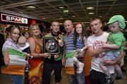 9 June 2013; Ireland's John Joe Nevin, who won gold in the 56kg Bantamweight division, with his family on his arrival home from the EUBC European Men's Boxing Championships 2013 in Belarus, at Dublin Airport. Photo by Matt Browne/Sportsfile