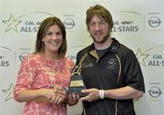 10 June 2013; Laois hurler Cahir Healy is presented with his GAA / GPA Player of the Month Award, sponsored by Opel, for May, by Laura Condron, Senior Brand and PR Manager Opel Ireland at Croke Park in Dublin. Photo by Barry Cregg/Sportsfile