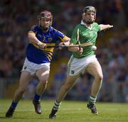 9 June 2013; Paddy Stapleton of Tipperary in action against Sean Tobin of Limerick during the Munster GAA Hurling Senior Championship Semi-Final match between Limerick and Tipperary at Gaelic Grounds in Limerick. Photo by Ray McManus/Sportsfile