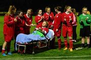 30 September 2015; Shelbourne U18 LFC captain Caolan Lynch Carroll awaits to be presented with the cup while on an ambulance trolley after picking up an injury during the first half. FAI Umbro Women’s Intermediate Cup Final, St Catherine’s LFC v Shelbourne U18 LFC. Frank Cooke Park, Glasnevin, Dublin. Picture credit: Piaras Ó Mídheach / SPORTSFILE