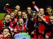 30 September 2015; Shelbourne U18 LFC players gather around their captain Caolan Lynch Carroll lifts the cup while on an ambulance trolley after picking up an injury during the first half. FAI Umbro Women’s Intermediate Cup Final, St Catherine’s LFC v Shelbourne U18 LFC. Frank Cooke Park, Glasnevin, Dublin. Picture credit: Piaras Ó Mídheach / SPORTSFILE