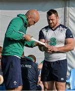 2 October 2015; Ireland's Cian Healy has his wrist strapped by team doctor Dr. Eanna Falvey during squad training. Ireland Rugby Squad Training, 2015 Rugby World Cup, Surrey Sports Park, University of Surrey, Guildford, England. Picture credit: Brendan Moran / SPORTSFILE