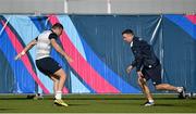 2 October 2015; Ireland's Robbie Henshaw, left, goes through a drill with assistant strength & conditioning coach John Kiely during squad training. Ireland Rugby Squad Training, 2015 Rugby World Cup, Surrey Sports Park, University of Surrey, Guildford, England. Picture credit: Brendan Moran / SPORTSFILE