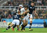 3 October 2015; Handre Pollard, South Africa, is tackled by Sam Hidalgo-Clyne, left, and Blair Cowan, Scotland. 2015 Rugby World Cup, Pool B, South Africa v Scotland, St James' Park, Newcastle, England. Picture credit: Ramsey Cardy / SPORTSFILE