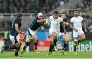 3 October 2015; Handre Pollard, South Africa, is tackled by Blair Cowan, left, and Peter Horne, Scotland. 2015 Rugby World Cup, Pool B, South Africa v Scotland, St James' Park, Newcastle, England. Picture credit: Ramsey Cardy / SPORTSFILE