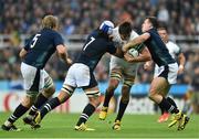3 October 2015; Lood de Jager, South Africa, is tackled by Blair Cowan, left, and Peter Horne, Scotland. 2015 Rugby World Cup, Pool B, South Africa v Scotland, St James' Park, Newcastle, England. Picture credit: Ramsey Cardy / SPORTSFILE