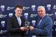 3 October 2015; Clare half forward Bobby Duggan is presented with his team of the year award by Bord Gáis Energy Sports Ambassador, Ger Cunningham. during the Bord Gáis Energy U21 Team of the Year 2015. The Marker Hotel, Dublin. Picture credit: Matt Browne / SPORTSFILE