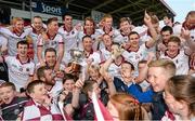 4 October 2015; The Slaughtneil players celebrate with the John McLaughlin cup after the game. Derry County Senior Football Championship Final, Coleraine v Slaughtneil, Celtic Park, Derry. Picture credit: Oliver McVeigh / SPORTSFILE