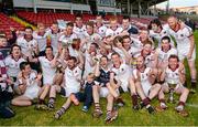 4 October 2015; The Slaughtneil players celebrate with the John McLaughlin cup after the game. Derry County Senior Football Championship Final, Coleraine v Slaughtneil, Celtic Park, Derry. Picture credit: Oliver McVeigh / SPORTSFILE