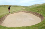 13 May 2009; John Daly plays from the edge of a bunker on the 13th fairway during the 3 Irish Open Golf Championship Practice Day, Wednesday. County Louth Golf Club, Baltray, Co. Louth. Picture credit: Matt Browne / SPORTSFILE
