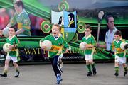 10 May 2009; Under 6 boys and girls from Watty Grahams GAA club, Maghera, Co. Derry, run out to participate in Lá na gClub activities as GAA clubs around the country celebrate the Anniversary with games and commemorative events in their local communities. Clubs have been encouraged to celebrate the GAA’s century and a quarter anniversary by organising events within their communities which underline their importance and special contribution to their respective areas. Picture credit: Oliver McVeigh/ SPORTSFILE  *** Local Caption ***