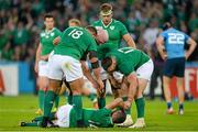 4 October 2015; Ireland's Robbie Henshaw is helped up by team-mates Nathan White, Paul O'Connell and Cian Healy after the final play of the game. 2015 Rugby World Cup, Pool D, Ireland v Italy, Olympic Stadium, Stratford, London, England. Picture credit: Brendan Moran / SPORTSFILE