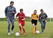 5 October 2015; Pictured are Republic of Ireland players Julianne Russell and Robbie Brady, with Aoife Farrell, age 10, and Lee Reid, age 11,  from St. Bernadette's Junior School, Clondalkin, Co. Dublin. The Republic of Ireland players made a surprise appearance at an exclusive SPAR training session at the National Sports Campus in advance of the Republic of Ireland vs Germany game on Thursday. SPAR is the Official Convenience Retail Partner of the FAI. FAI National Training Centre, National Sports Campus, Abbotstown, Dublin. Picture credit: David Maher / SPORTSFILE