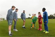 5 October 2015; Pictured are Republic of Ireland players  Eunan O'Kane, Jonathan Walters and Robbie Brady with children from left,  Lee Reid, age 11, Tadhg Curran, age 11, Aoife Farrell, age 10, and Temilade Fetuga, age 11,  from St. Bernadette's Junior School, Clondalkin, Co. Dublin. The Republic of Ireland players made a surprise appearance at an exclusive SPAR training session at the National Sports Campus in advance of the Republic of Ireland vs Germany game on Thursday. SPAR is the Official Convenience Retail Partner of the FAI. FAI National Training Centre, National Sports Campus, Abbotstown, Dublin. Picture credit: David Maher / SPORTSFILE