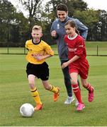 5 October 2015; Pictured are Republic of Ireland's Robbie Brady, with Aoife Farrell, age 10, and Lee Reid, age 11,  from St. Bernadette's Junior School, Clondalkin, Co. Dublin. The Republic of Ireland players made a surprise appearance at an exclusive SPAR training session at the National Sports Campus in advance of the Republic of Ireland vs Germany game on Thursday. SPAR is the Official Convenience Retail Partner of the FAI. FAI National Training Centre, National Sports Campus, Abbotstown, Dublin. Picture credit: David Maher / SPORTSFILE