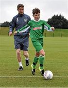 5 October 2015; Pictured are Republic of Ireland's Eunan O'Kane with Tadhg Curran, age 11,  from St. Bernadette's Junior School, Clondalkin, Co. Dublin. The Republic of Ireland players made a surprise appearance at an exclusive SPAR training session at the National Sports Campus in advance of the Republic of Ireland vs Germany game on Thursday. SPAR is the Official Convenience Retail Partner of the FAI. FAI National Training Centre, National Sports Campus, Abbotstown, Dublin. Picture credit: David Maher / SPORTSFILE