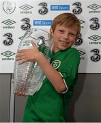 8 October 2015; Rian McEntaggart, age 7, from Dunshaughlin, Co. Meath, pictured with the Man of the Match trophy, was the lucky little footie fan that won a 3Plus VIP experience to get him behind-the-scenes on match day. Three, proud sponsor of the Irish football team. Aviva Stadium, Lansdowne Road, Dublin. Picture credit: Cody Glenn / SPORTSFILE