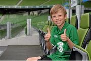 8 October 2015; Rian McEntaggart, age 7, from Dunshaughlin, Co. Meath, pictured seated on the Republic of Ireland players' seats, was the lucky little footie fan that won a 3Plus VIP experience to get him behind-the-scenes on match day. Three, proud sponsor of the Irish football team. Aviva Stadium, Lansdowne Road, Dublin. Picture credit: Cody Glenn / SPORTSFILE