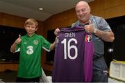 8 October 2015; Rian McEntaggart, age 7, from Dunshaughlin, Co. Meath, pictured holding the jersey of goalkeeper Shay Given with equipment manager Dick Redmond, in the Republic of Ireland dressing room, was the lucky little footie fan that won a 3Plus VIP experience to get him behind-the-scenes on match day. Three, proud sponsor of the Irish football team. Aviva Stadium, Lansdowne Road, Dublin. Picture credit: Cody Glenn / SPORTSFILE