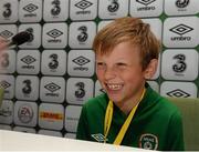8 October 2015; Rian McEntaggart, age 7, from Dunshaughlin, Co. Meath, pictured answering questions at a mock Republic of Ireland press conference, was the lucky little footie fan that won a 3Plus VIP experience to get him behind-the-scenes on match day. Three, proud sponsor of the Irish football team. Aviva Stadium, Lansdowne Road, Dublin. Picture credit: Cody Glenn / SPORTSFILE