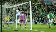 8 October 2015; Christos Aravidis, Greece, fails to prevent a header from Northern Ireland's Josh Magennis, hidden, going into the net to give Northern Ireland their second goal . UEFA EURO 2016 Championship Qualifier, Group F, Northern Ireland v Greece. Windsor Park, Belfast. Picture credit: Oliver McVeigh / SPORTSFILE