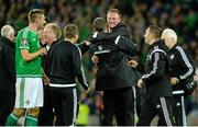 8 October 2015; Northern Ireland Michael O'Neill manager gets a hug during the celebrations after the game. UEFA EURO 2016 Championship Qualifier, Group F, Northern Ireland v Greece. Windsor Park, Belfast. Picture credit: Oliver McVeigh / SPORTSFILE