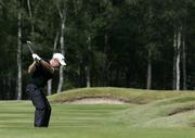 21 May 2009; Ireland's Paul McGinley plays an approach shot during round 1 of the BMW PGA Championship. Wentworth Golf Club, Virginia Water, Surrey, England. Picture credit: Tim Hales / SPORTSFILE