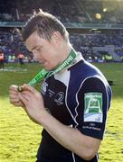 23 May 2009; Leinster's Brian O'Driscoll studies his medal. Heineken Cup Final, Leinster v Leicester Tigers, Murrayfield Stadium, Edinburgh, Scotland. Picture credit: Richard Lane  / SPORTSFILE