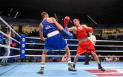 9 October 2015; Albert Selimov, right, Azerbaijan, exchanges punches with Sean McComb, left, Ireland, during their Men's Lightweight 60kg last 16 bout. AIBA World Boxing Championships, Ali Bin Hamad Al Attiyah Arena, Doha, Qatar. Photo by Sportsfile
