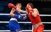 9 October 2015; Albert Selimov, right, Azerbaijan, exchanges punches with Sean McComb, left, Ireland, during their Men's Lightweight 60kg last 16 bout. AIBA World Boxing Championships, Ali Bin Hamad Al Attiyah Arena, Doha, Qatar. Photo by Sportsfile