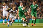 8 October 2015; Wes Hoolahan, Republic of Ireland, in action against Marco Reus, Germany. UEFA EURO 2016 Championship Qualifier, Group D, Republic of Ireland v Germany. Aviva Stadium, Lansdowne Road, Dublin. Picture credit: Ramsey Cardy / SPORTSFILE